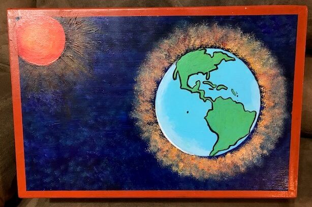 box with painting of earth and sun