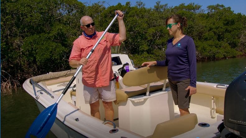 Two people paddling a boat