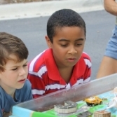 Two boys looking at a model environment