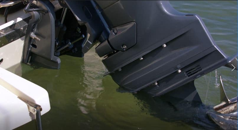 Boat engine tilting up out of water